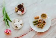overhead shot of a plate with a cup of coffee and baklava