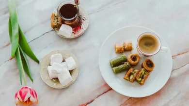 overhead shot of a plate with a cup of coffee and baklava